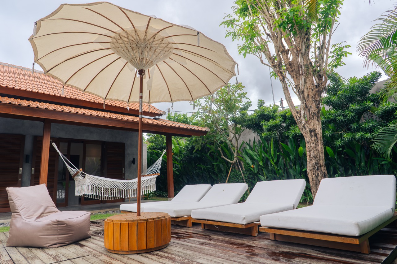 Lush garden and pool area reflecting maintenance services